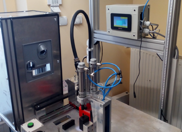 PLC controlled stamping and inspection workstation with integrated camera, printer head