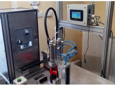 PLC controlled stamping and inspection workstation with integrated camera, printer head