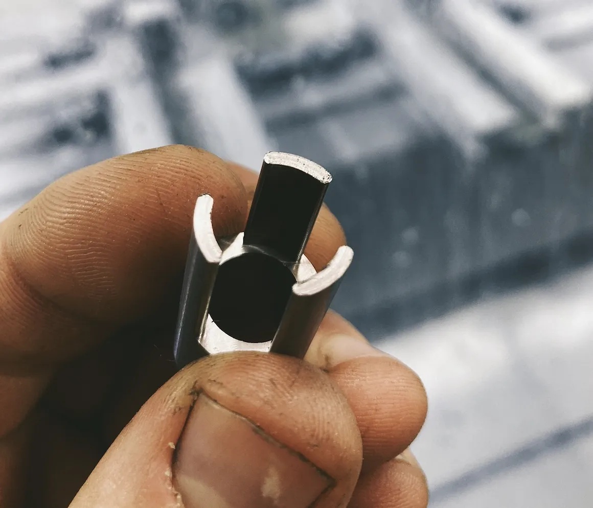 ejector for a miniature punch-die assembly