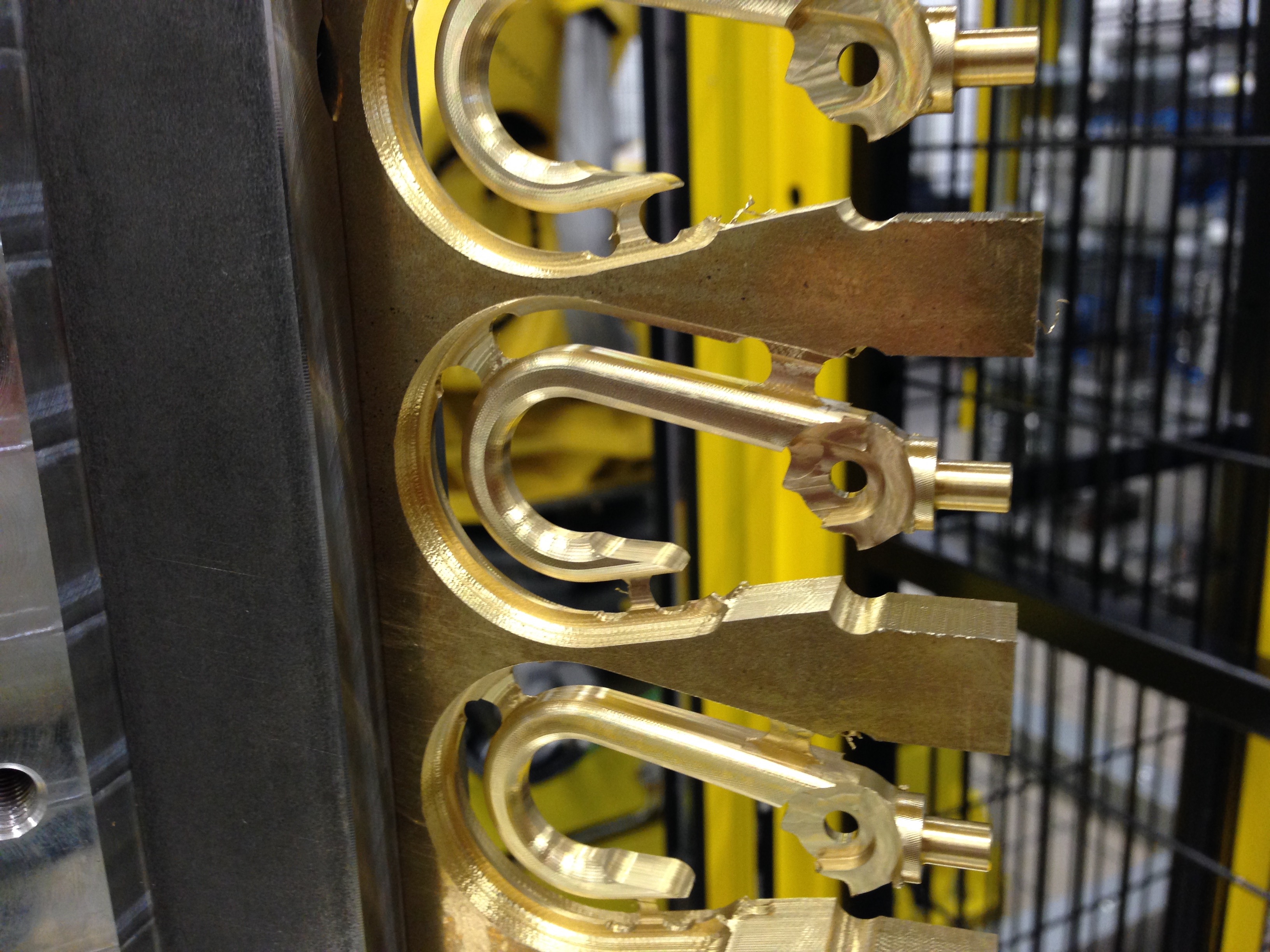 Bag hook in brass milled from block