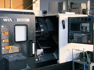 CNC-Drehmaschine mit AGW und Stangenlader