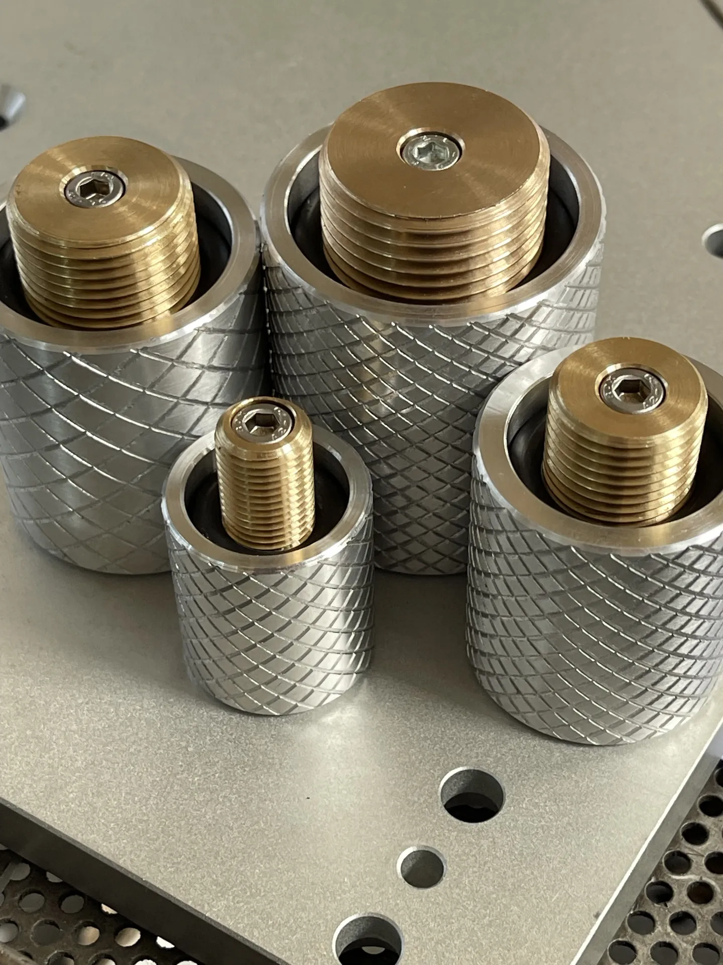 testing caps bronze and aluminium