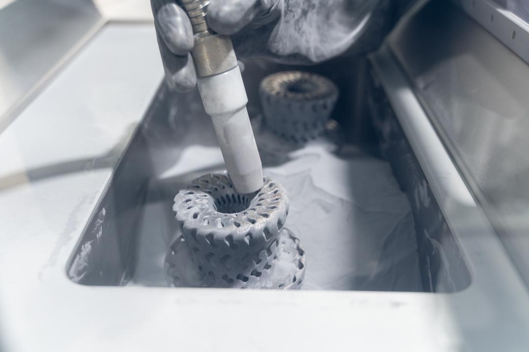Depowdering