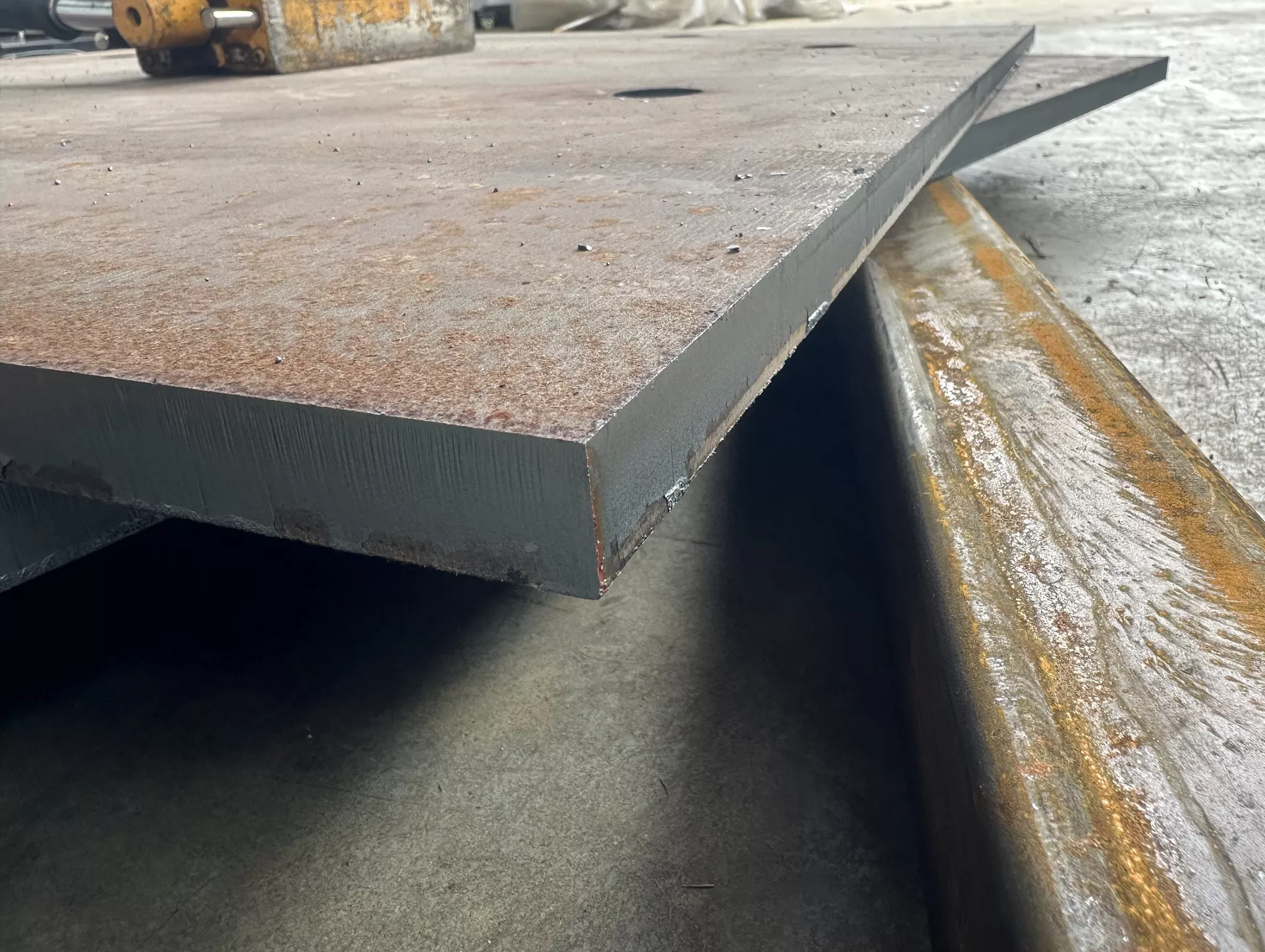 Fabricated steel plate assembly with welded edge reinforcement.