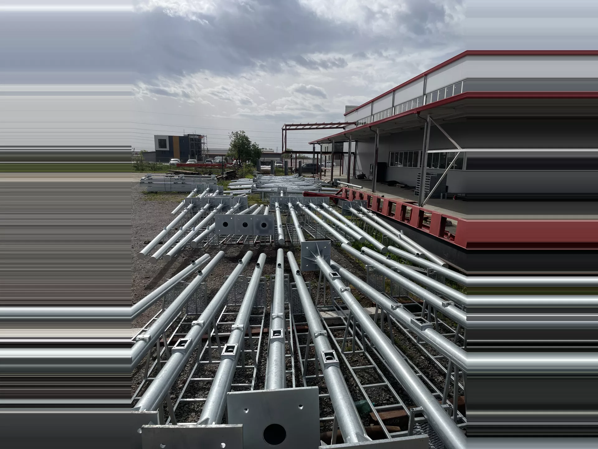 Batch-produced steel frames and supports prepared for delivery.