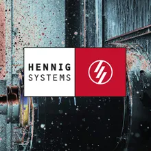 Hennig Systems GmbH Feinwerktechnik & Maschinenbau Logo